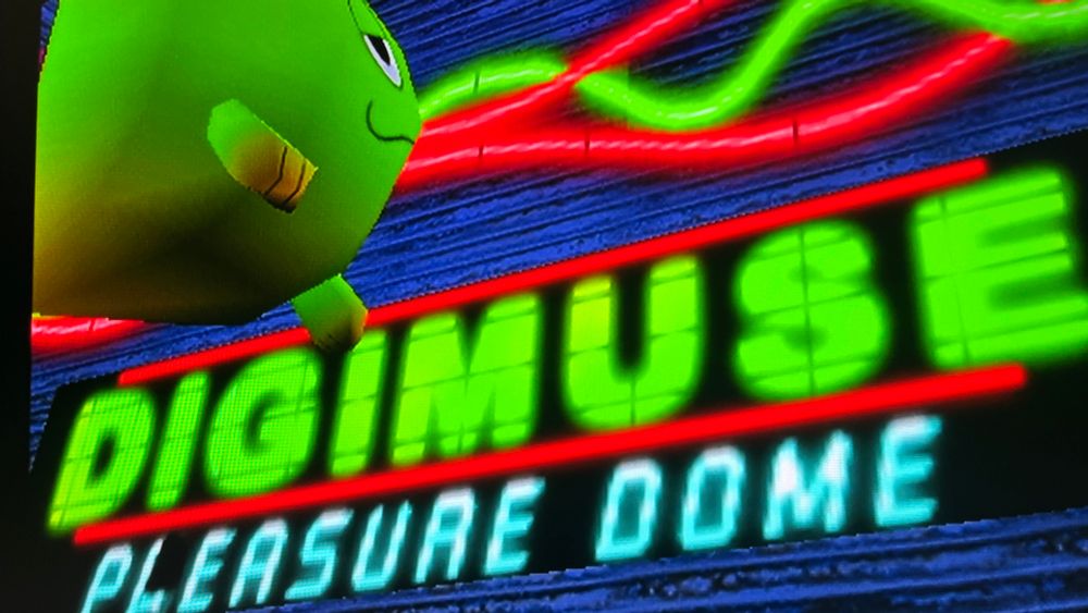 Screenshot from Blue Stinger (Dreamcast):

A neon arcade sign that reads “Digimuse Pleasure Dome”