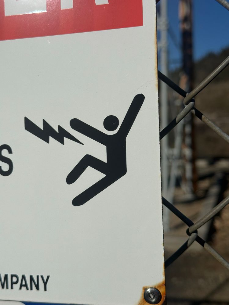 A stick figure either peeing lightning or getting zapped in the crotch 