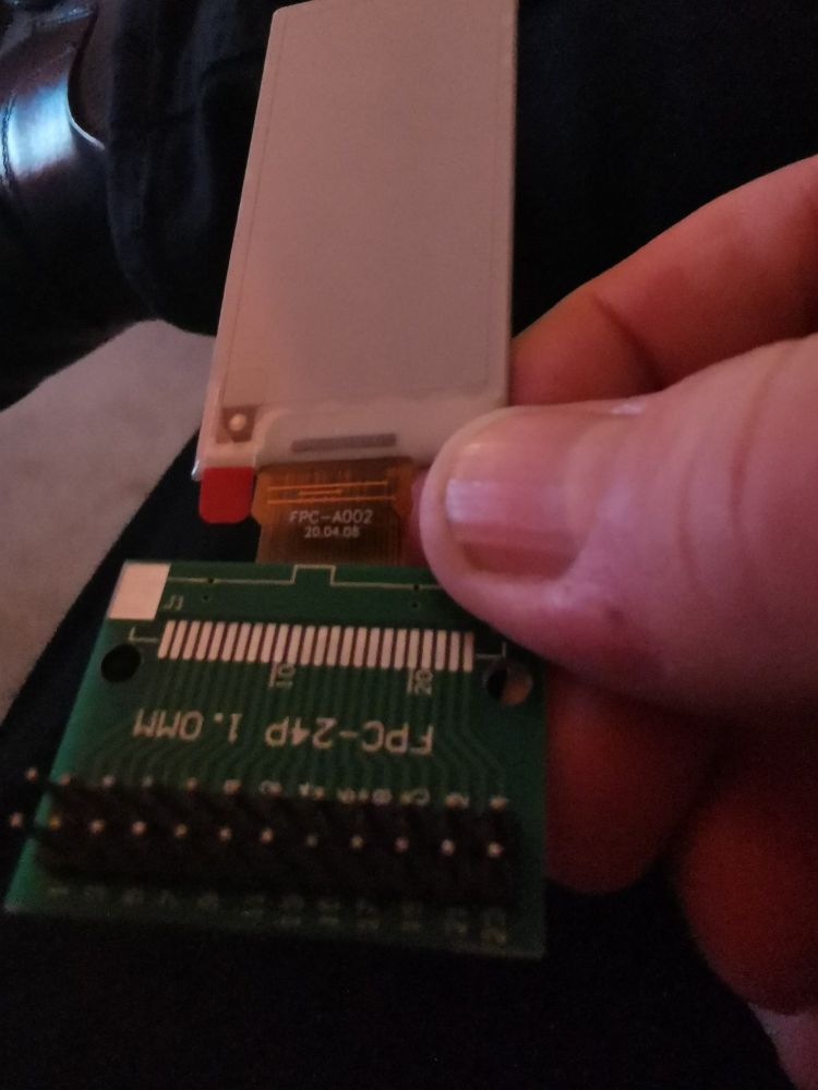 Eink display with adaptor board from thin ribbon to pins. 