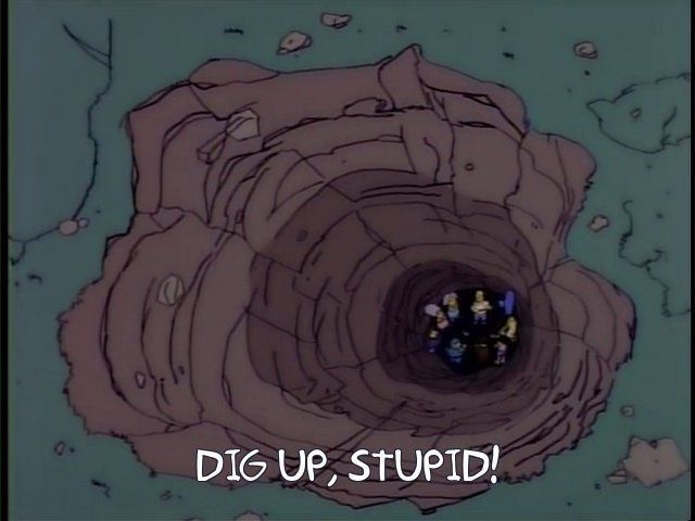 A clip from the Simpsons episode with the big treasure under the "T," with various cast members at the bottom of a big hole. Chief Wiggum is saying "dig up, stupid."