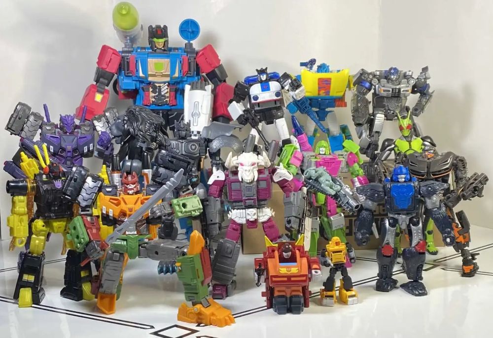 A big group of Transformers action figures (plus a Kamen Rider), all posed together. This is from my Best of 2023 article, so they're all from that year.