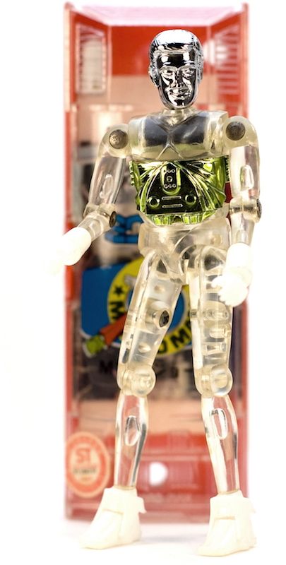 A vintage Microman toy, cast in clear plastic, with some silver and gold chrome bits. 