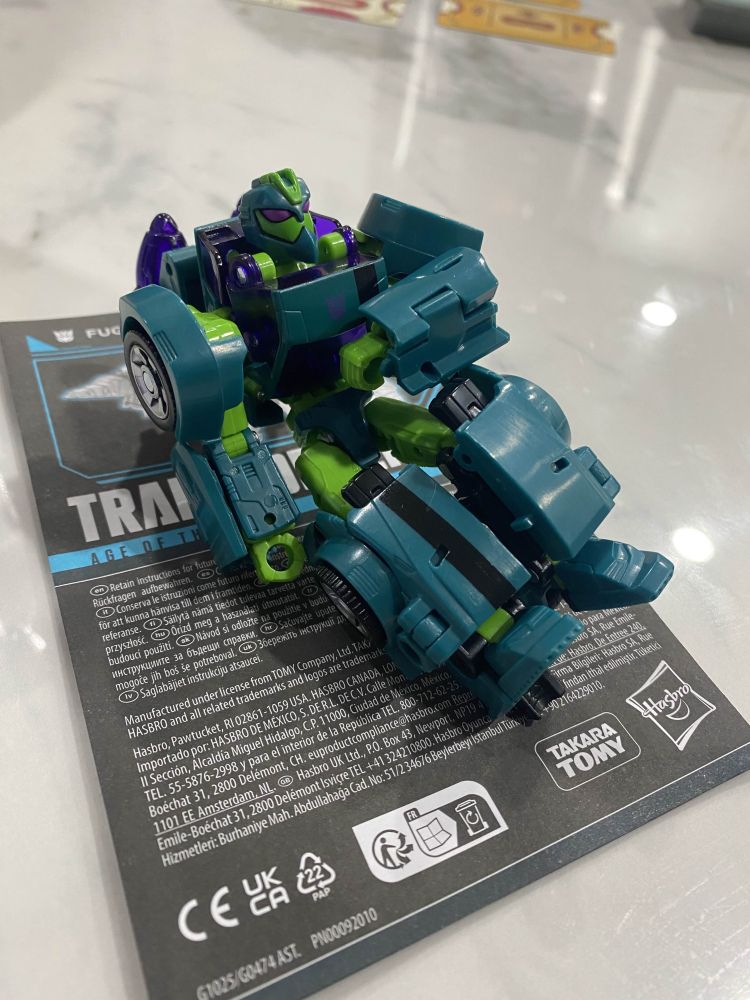 AOTP Fugitive Waspinator, in robot mode, sitting and lounging.