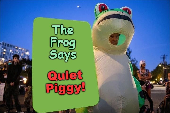 Protester in frog costume. "The Frog Says Quiet Piggy!"
