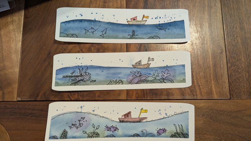 Three bookmarks of a cutesy sea scene. Boat, fish, coral 