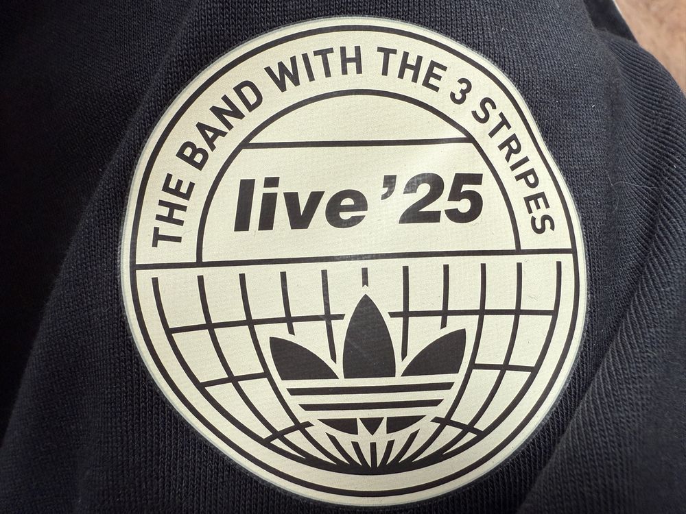 Oasis Adidas collab logo. The band with the 3 stripes Live ‘25.