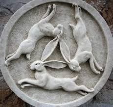 It's the Tinner's Hares, three hares running in a circle, their ears forming a triangle inside it.  It is a strange symbol that shows up all over the Silk Road, and as far as anyone can tell doesn't really have a deeper meaning to it.  Which is to say, don't forget to say "Rabbits Rabbits Rabbits" today.