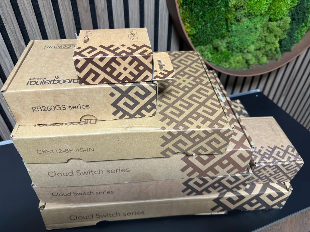A stack of 6 MikroTik switch boxes which are installed throughout the author’s house