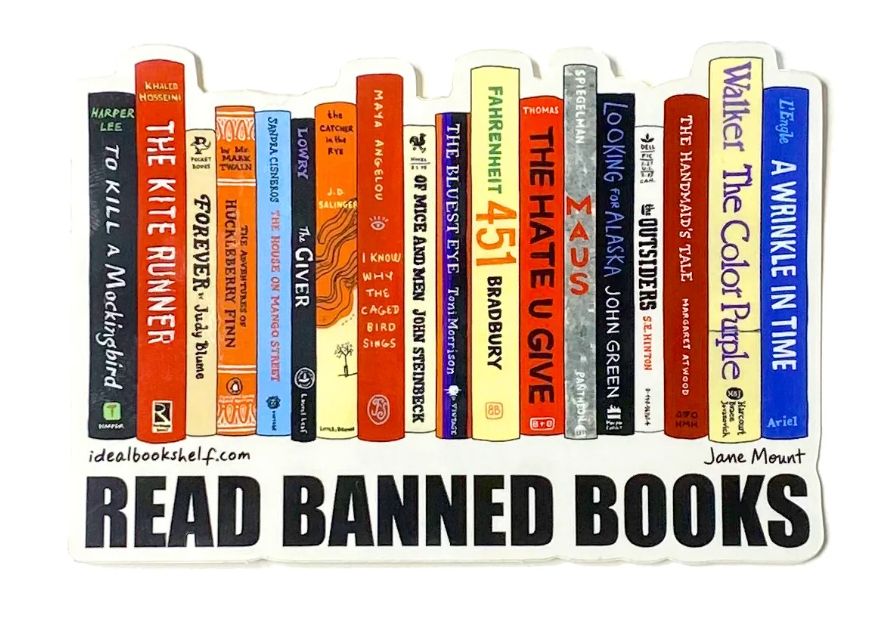 Read Banned Books under a shelf of books.