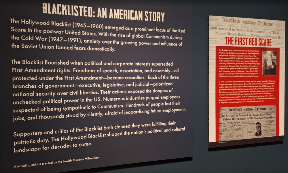 Blacklisted: An American Story exhibit with description of the exhibit and on the right a poster describing the precursor the First Red Scare