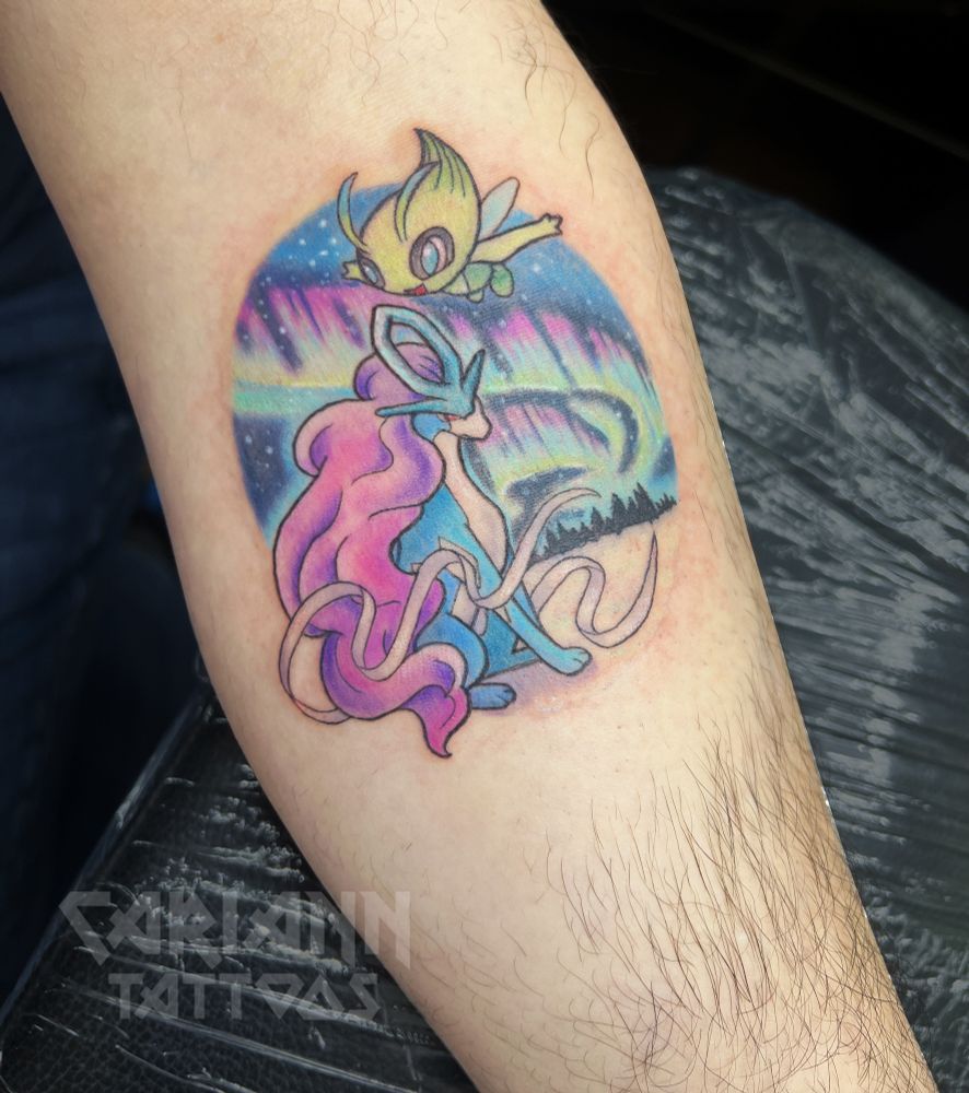 Pokemon Suicune sitting in foreground with Celebi flying above. Background has northern lights in a snowy landscape