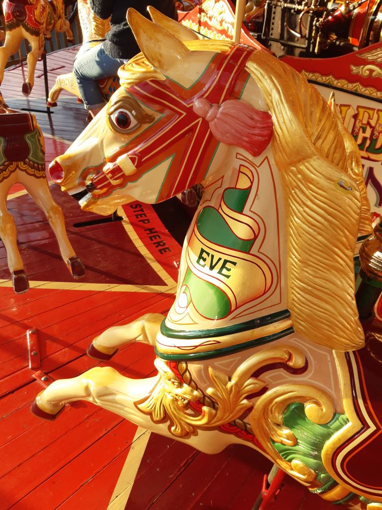 Painted golden carousel horse