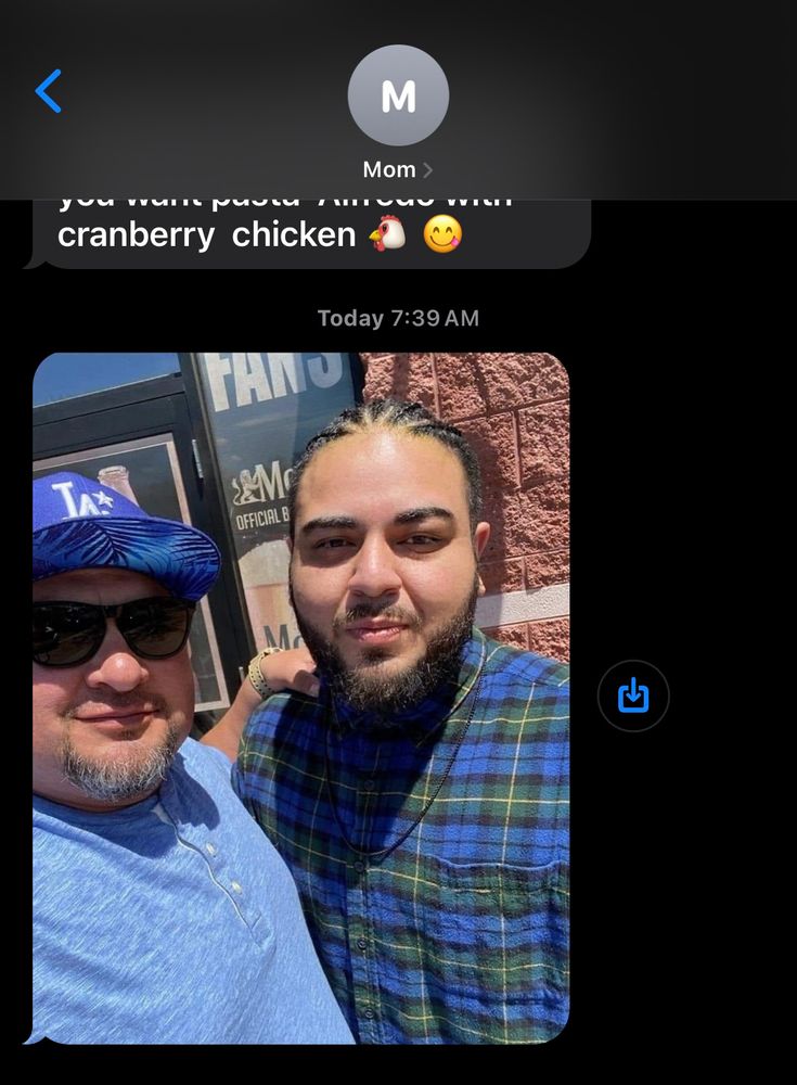 My mom sends me a picture via text of my uncle and I outside of a BWW