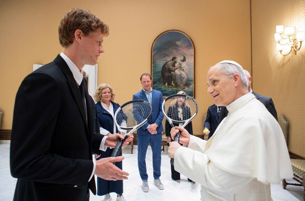 Pope Leo holds a tennis racket in the Vatican