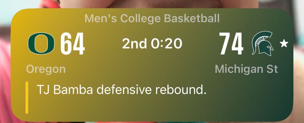 Scoreboard showing MSU 74, Oregon 64. 