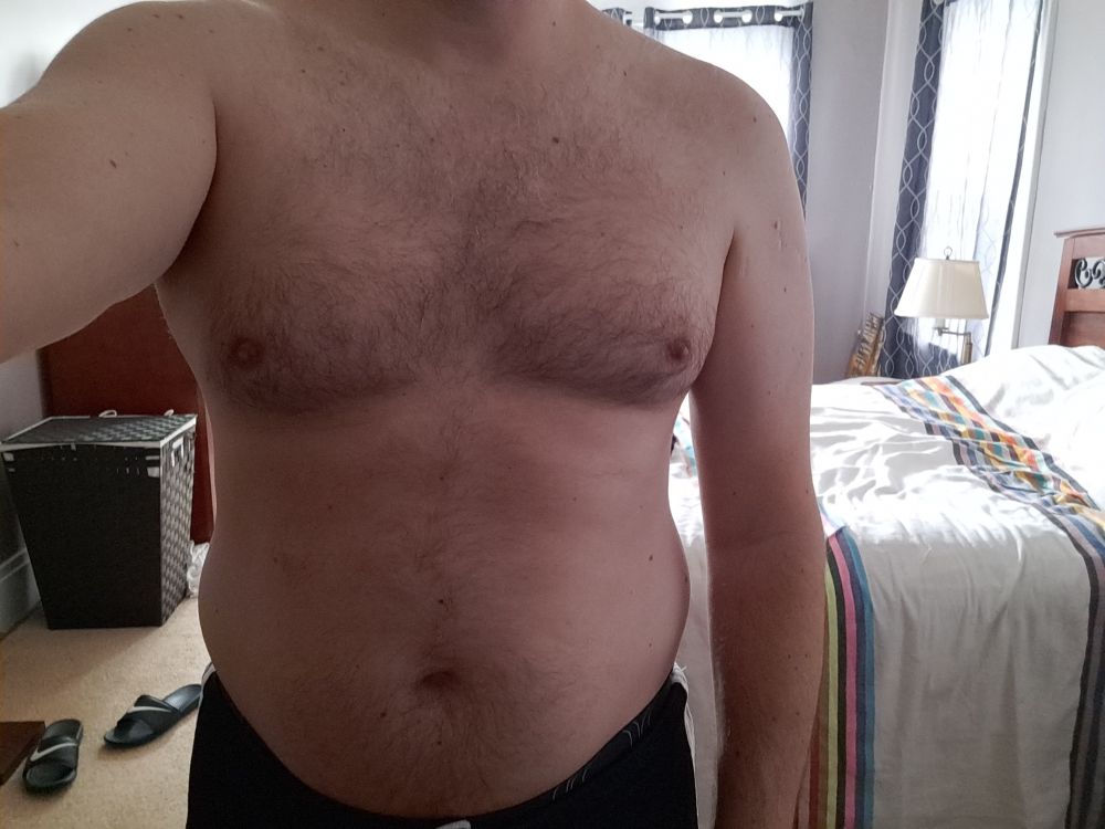 A pudgy midriff on a middle aged man.