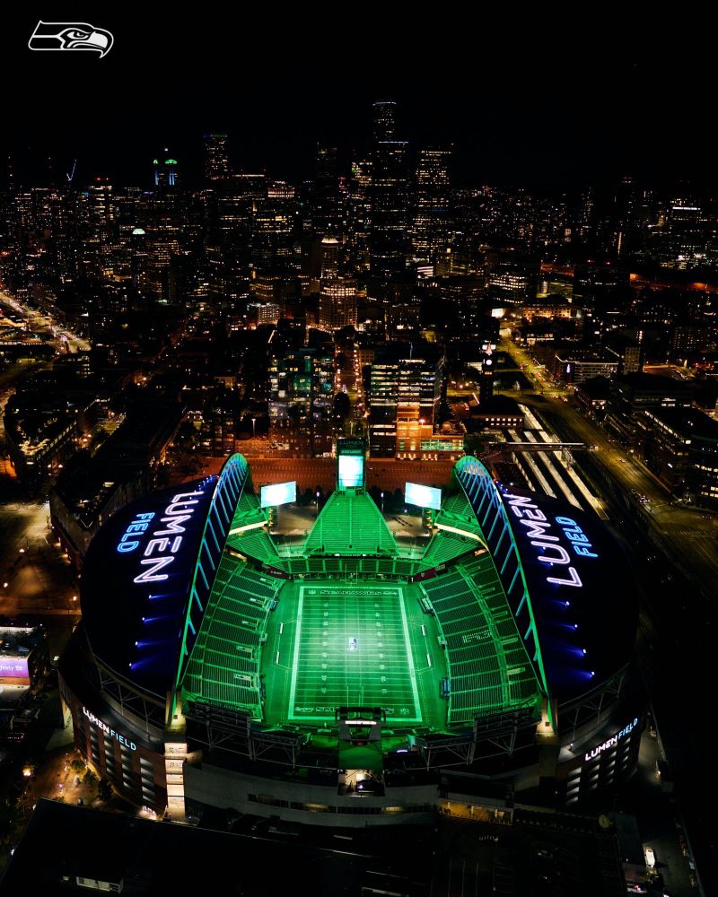 Birds Eye view of Lumen Field illuminated in green for Sunday Night Football