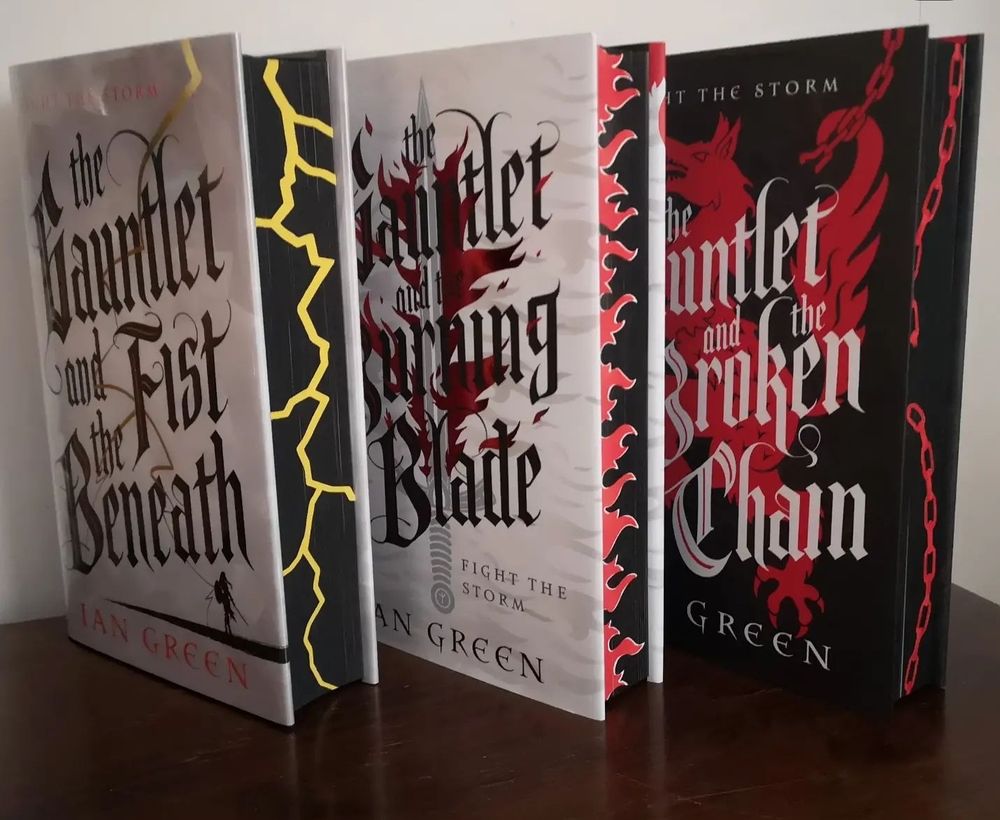 Rotstorm trilogy by Ian Green with custom sprayed edges- lightning, flame, and broken chain for books 1-3 respectively 
