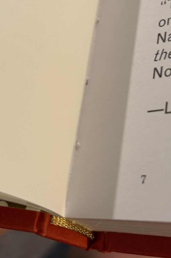 a detailed look at the binding, you can clearly see the stitch marks attaching the signatures to the binding
