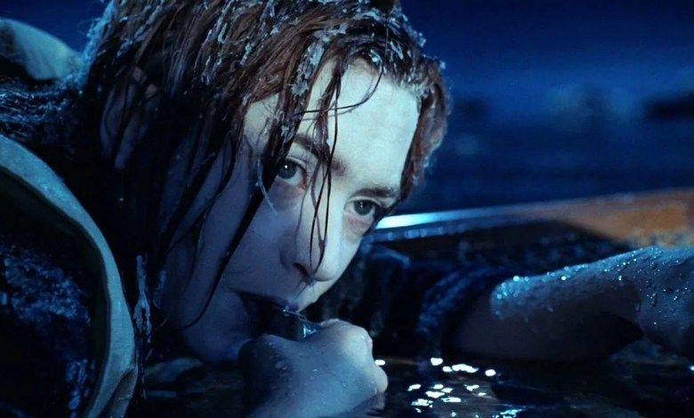 Kate Winslett as Rose in the film Titanic, clinging to the stupid door like I clung to that invite code, pictured here freezing to death in the North Atlantic and blowing her whistle for help