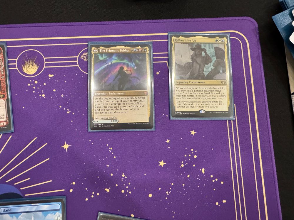Magic: The gathering board. We have Kellan Joins Up and The Prismatic Bridge, the second of which we got to cast for free on turn 3. We won this game. 