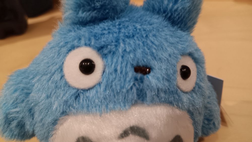Extreme close-up of a very small plush of Totoro