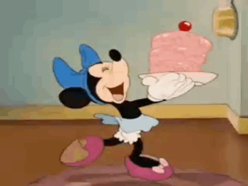 a cartoon of minnie mouse holding a large pink cake on a plate .