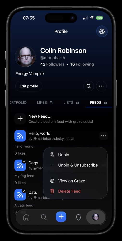 Screenshot of a social media profile page. The top of the screen displays the time battery percentage and network icons. Below that is the profile name Colin Robinson with a profile picture of a bald man wearing glasses. The profile has 42 followers and 16 following. There is an "Edit profile" button. Below the profile information are tabs labeled RTFOLIO LIKES LISTS and FEEDS with FEEDS currently selected. A section titled New Feed shows an option to create a custom feed. Below are posts with icons indicating they are from RSS feeds. The first post reads Hello world by mariobarth.bsky.social with 0 likes. The second post reads Dogs by mario with a checkmark and 0 likes. The third post reads My fog feed with 0 likes. The fourth post reads Cats by mario with 0 likes. A pop-up menu next to the first post offers options to Unpin Unpin & Unsubscribe View on Graze and Delete Feed. The bottom of the screen has navigation icons for home search plus notifications and profile.