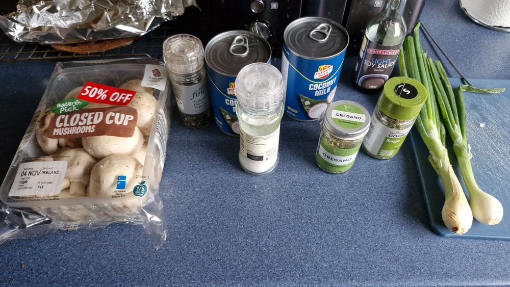 Ingredients for mushroom soup - soy sauce, Mushrooms, salt, pepper, coconut milk, oregano, sage and spring onions 