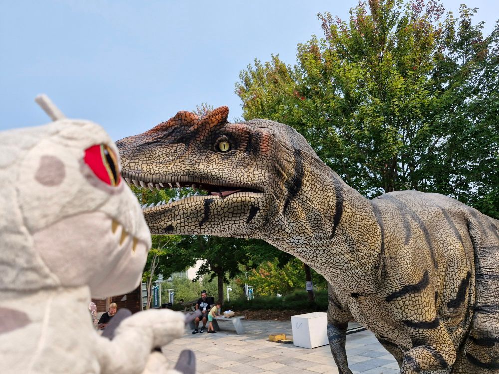 My Indominus Rex plush next to Alan the Allosaurus