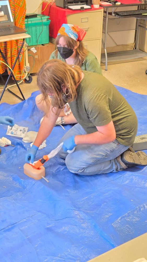 comrades learning how to tend to wounds