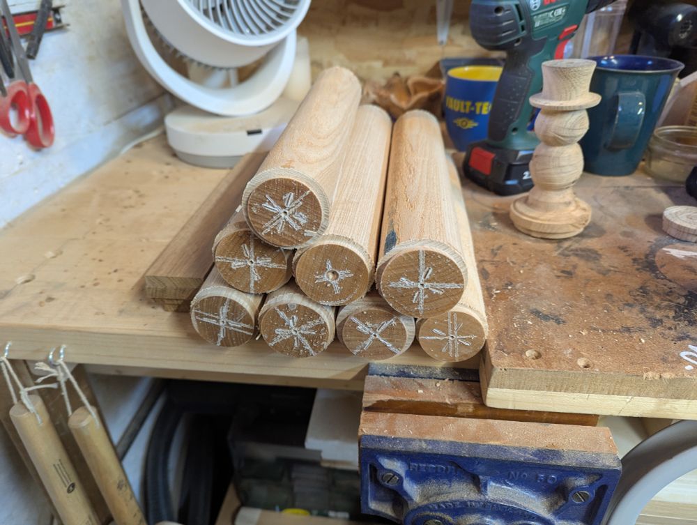 A photograph of the 8 remaining ash spindles I have, to turn the rest of the snowmen. (also in shot, a test snowman turned from oak, again with a top hat).