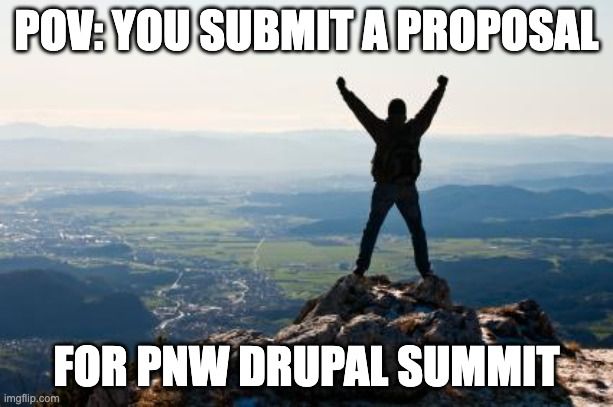 Person on a mountain celebrating the submission of the PNW Drupal Summit proposal