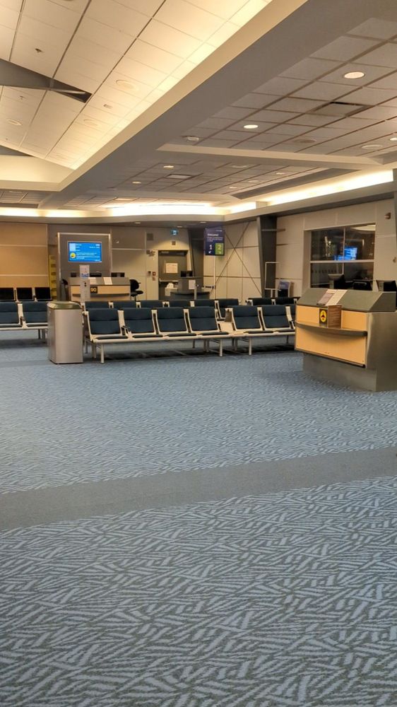 A completely empty airport gate, as if it came from DOOM or a post apocalyptic survival game