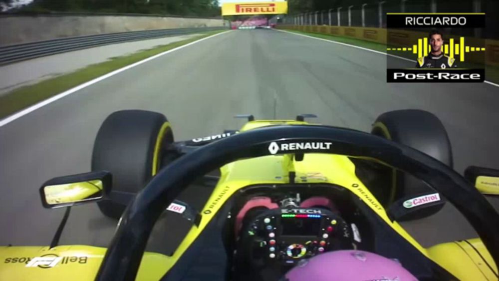 ricciardo is driving a yellow renault race car on a track