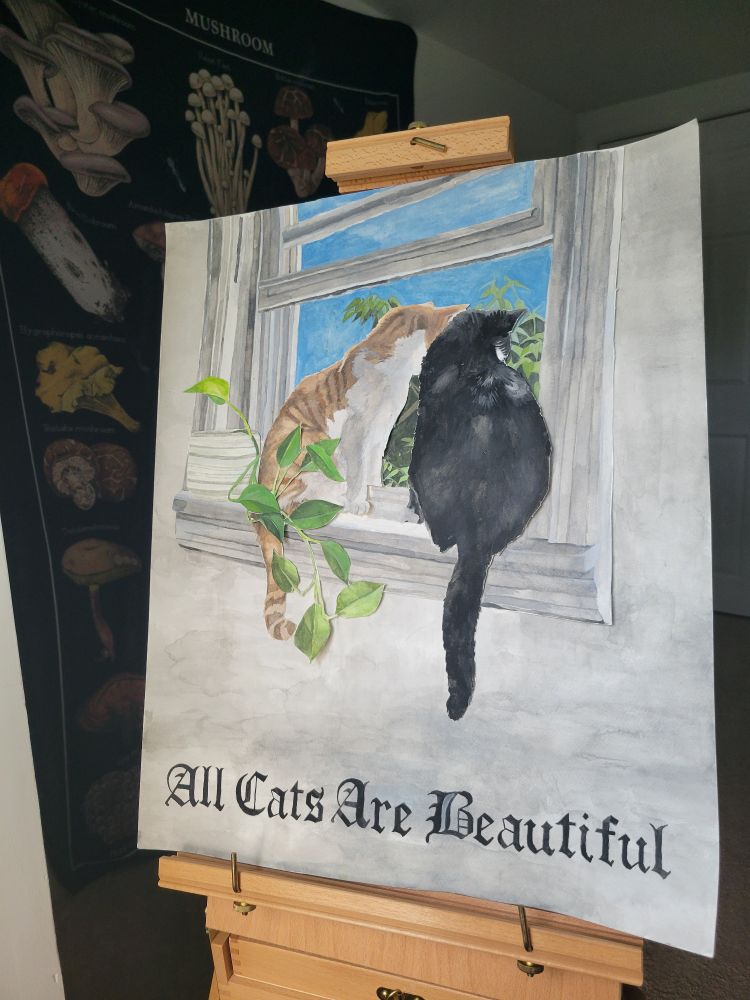 An orange and white cat next to a tuxedo cat on a window sill. They are looking out into the trees and blue sky. Wrapped around the orange cat is a pathos plant sitting on the edge of the window sill. 
Below them in a gothic font reads, "All Cats Are Beautiful."