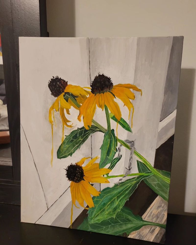 All three pictures are of my new painting. Two were taken by camera, and one is a scan. The painting is of three black-eyed susans (a type of flower that is yellow with a brown center in the aster family). They are growing in a backyard. The flowers have drips of yellows to give an appearance of melting. Hanging from the flowers is barbed wire. They are growing from the back of a wooden raised garden bed, and facing a white fence.