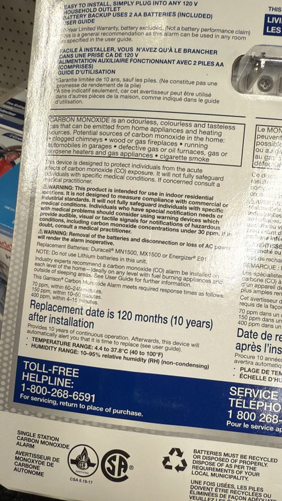 Photo of the back of a package of a carbon monoxide detector, highlighting replacement date and at what levels the detector goes off 