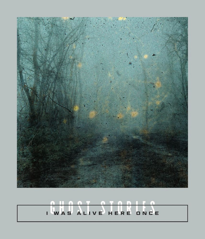 The spooky, gray-framed cover of the book I Was Alive Here Once: Ghost Stories, the new volume of Calico collections of translated literature from The Center for the Art of Translation