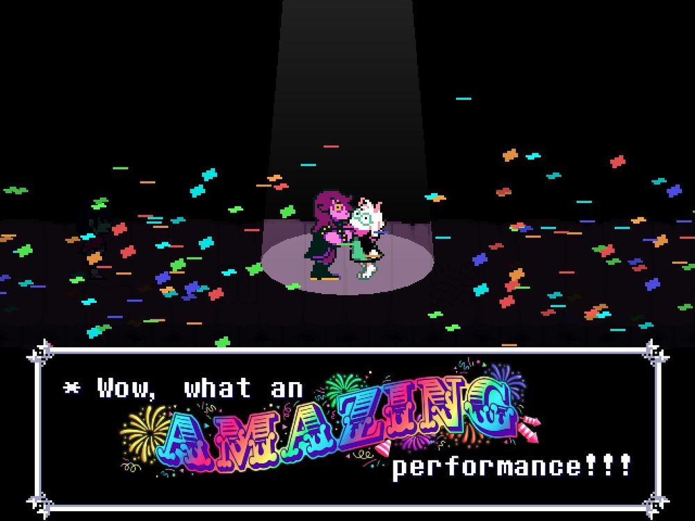 Screenshot of Mr. Tenna's first line of dialogue in Deltarune Chapter 3. The word "AMAZING" is set in Cast Iron by West Wind Fonts. The type is purple with a rainbow gradient, surrounded by fireworks and confetti. 