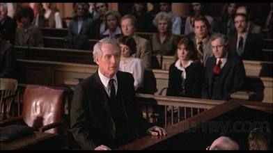 Image from the film ‘The Verdict’ with Paul Newman in a suit, standing in a courtroom and speaking to a jury.