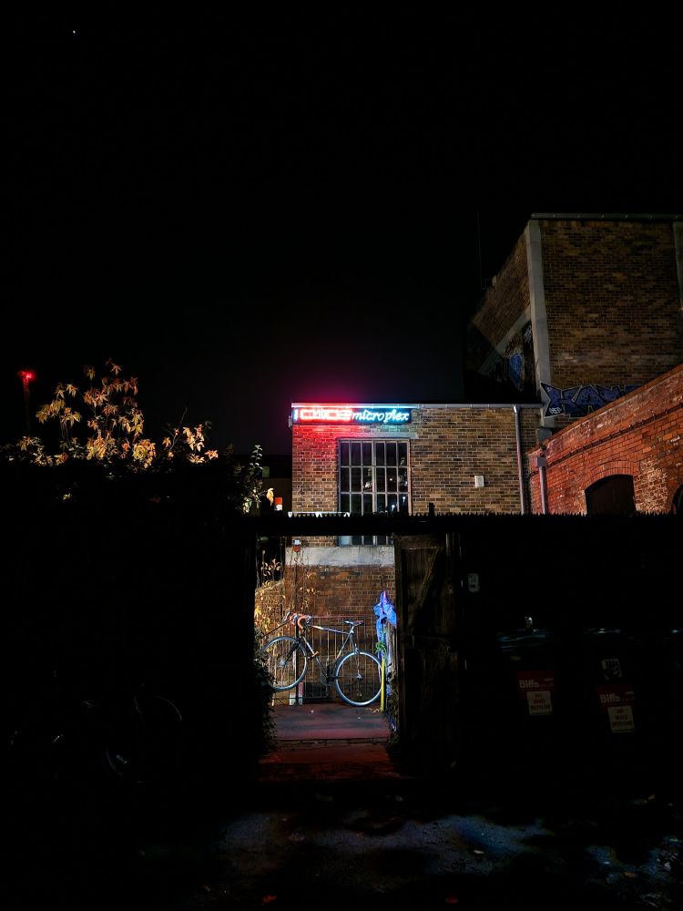 Shot of Cube Microplex neon sign at night 