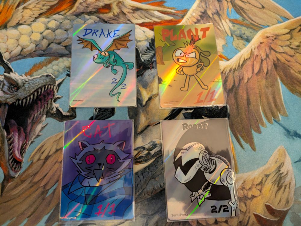 Custom Magic: The Gathering tokens made by Turn1Proxy!!

Top Left: Custom 2/2 Drake token
Top Right: Custom 1/1 Plant token
Bottom Left: Custom 1/1 Cat token
Bottom Right: Custom 2/2 Robot token