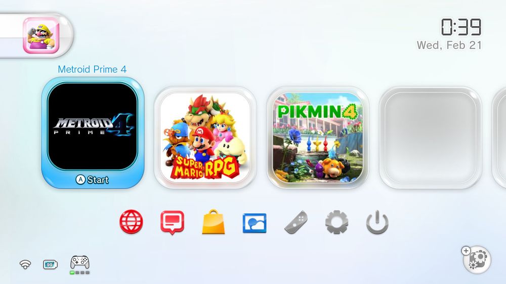 Nintendo Switch's home menu with a skeuomorphic look. The user interface elements are as follows:

To the top-left corner there's a pill-shaped user profiles tree, showing only one user donning a Wario icon.

To the top-right corner there's a clock and calendar date.

To the bottom-right corner there's a game details prompt.

To the bottom-left corner there are indicators for the Wi-Fi signal, battery, and connected controller.

To the bottom of the center lies the icons for following OS functions: Switch Online, News, eShop, Images, Controllers, Settings and Sleep Mode.

To the center are the game icons, showing Metroid Prime 4, Super Mario RPG and Pikmin 4, with the rest of the icons being empty. The frame-shaped cursor is focused on Metroid Prime 4.