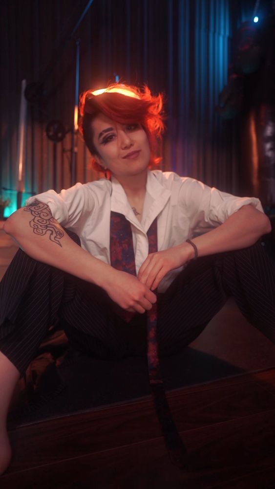me, sitting in a shirt and tie, smirking hehe 