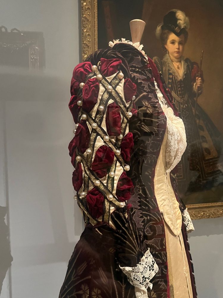 Detail of a sleeve, red and white with pearls by Worth