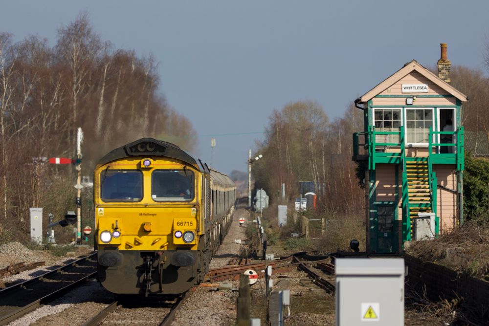 Freightliner class 66 - 66715 - passes the signal box at Whittlesea as it works 6E88 Middleton Towers to Goole Glassworks.