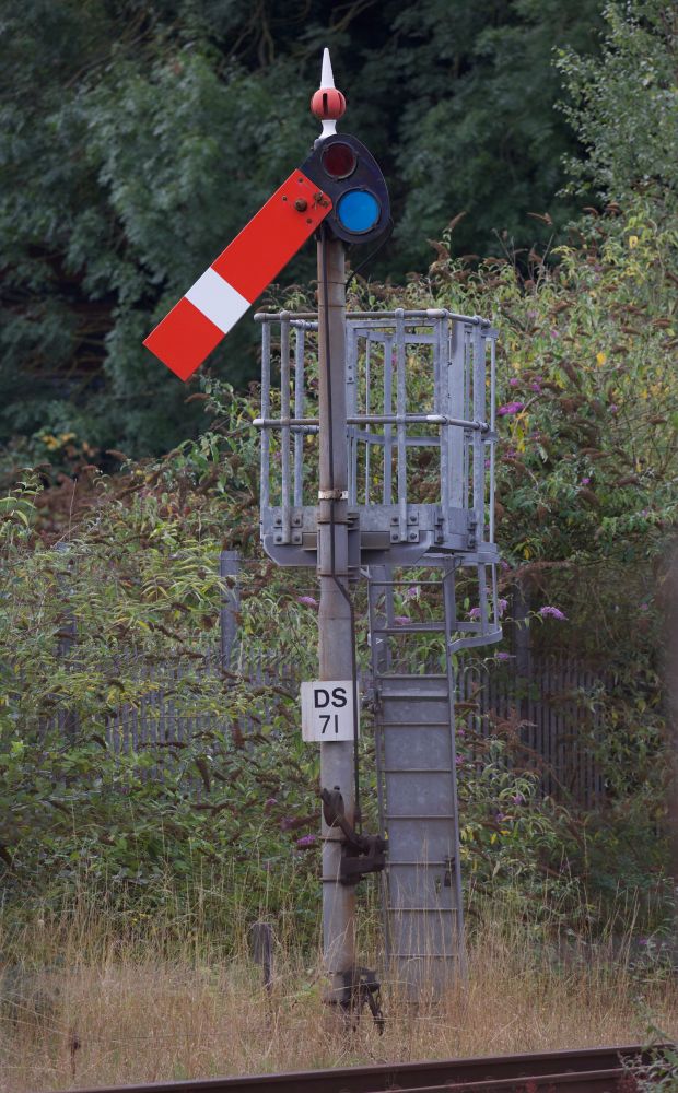 Lower quadrant semaphore DS71 at Droitwich Spa is cleared for the approach of a Worcester-bound service.