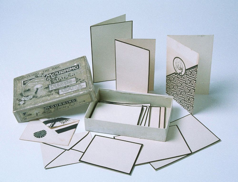 Collection of writing paper, cards, and envelopes with black borders or designs, for mourning