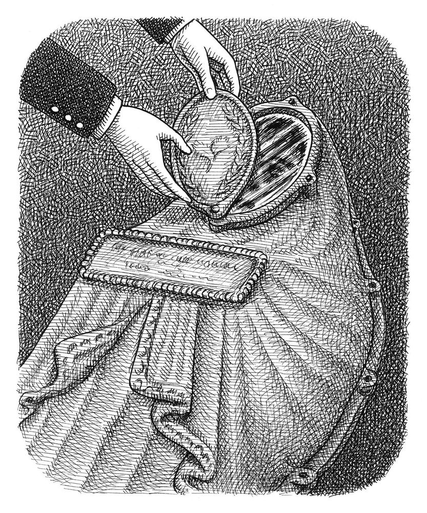Two hands open the swiveling cover of a Fisk cast iron coffin.